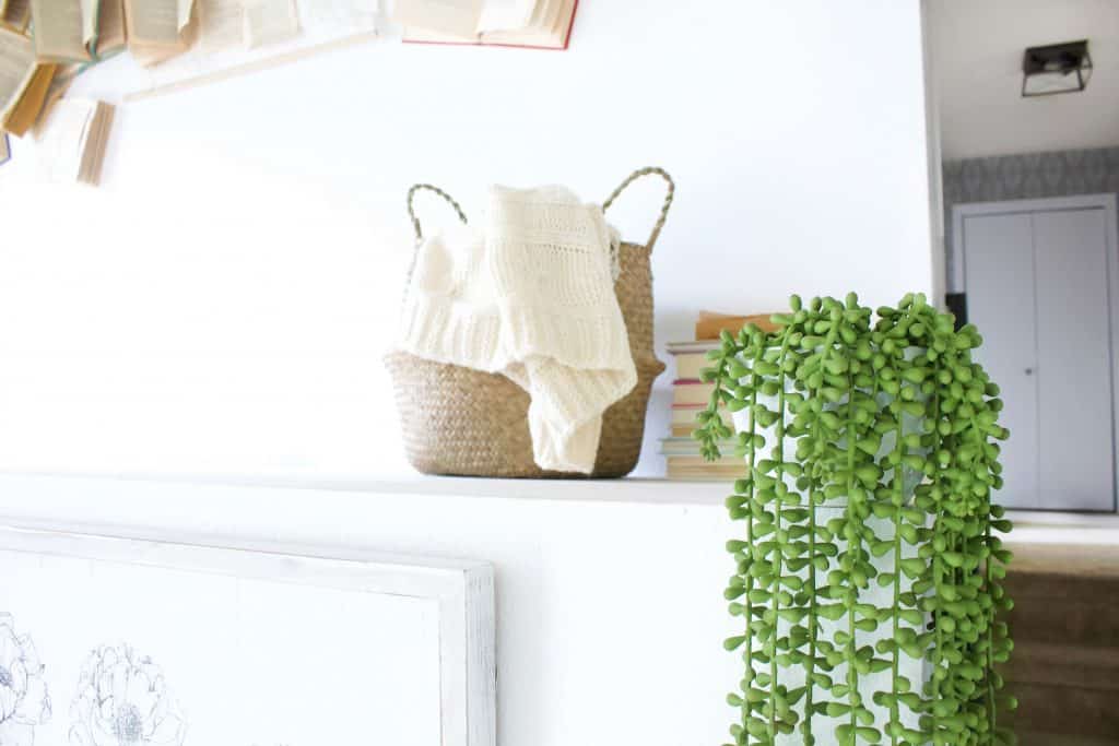 Comfy blanket in a basket, ready to read a good book.