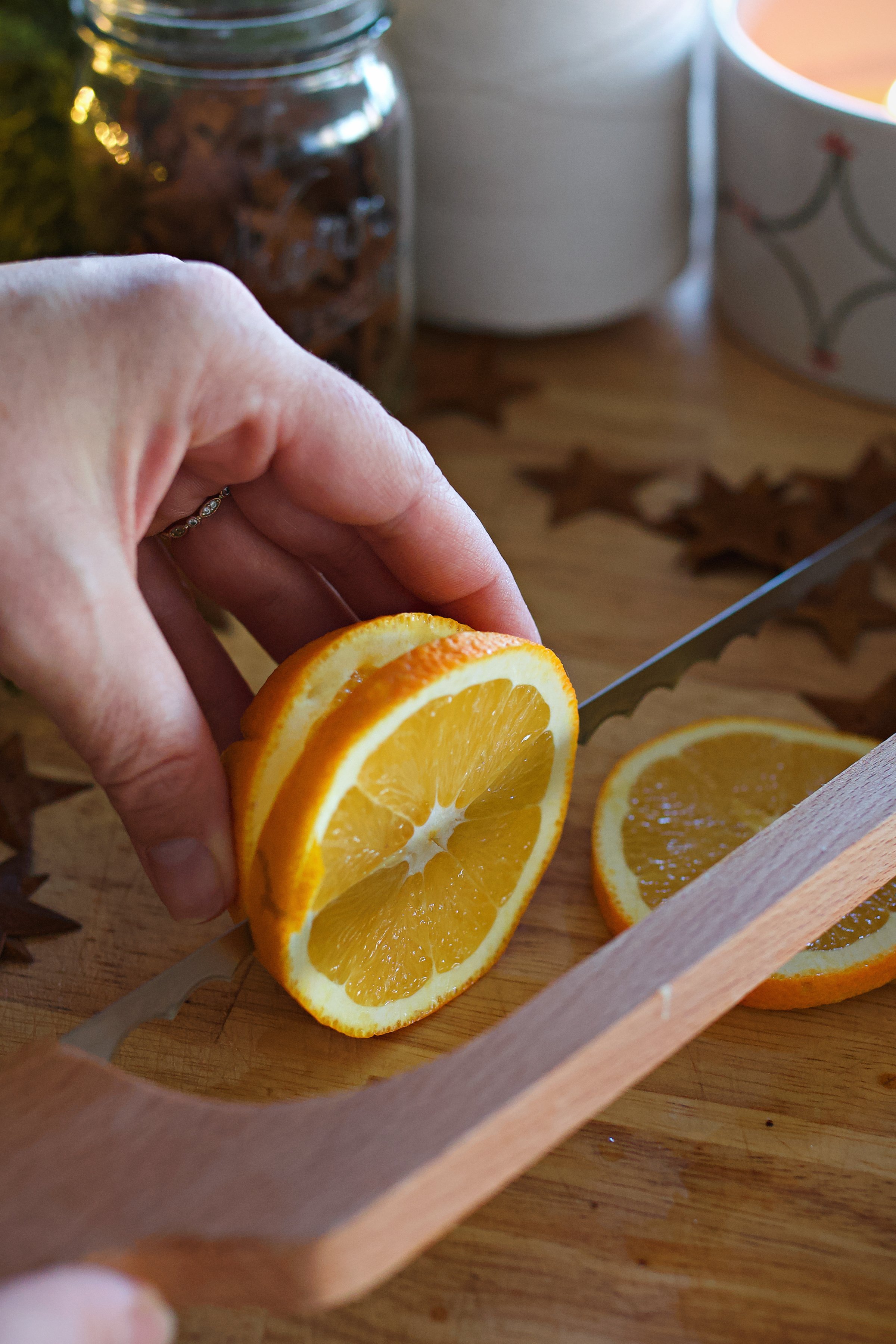 Slicing a lemon on a counter. 