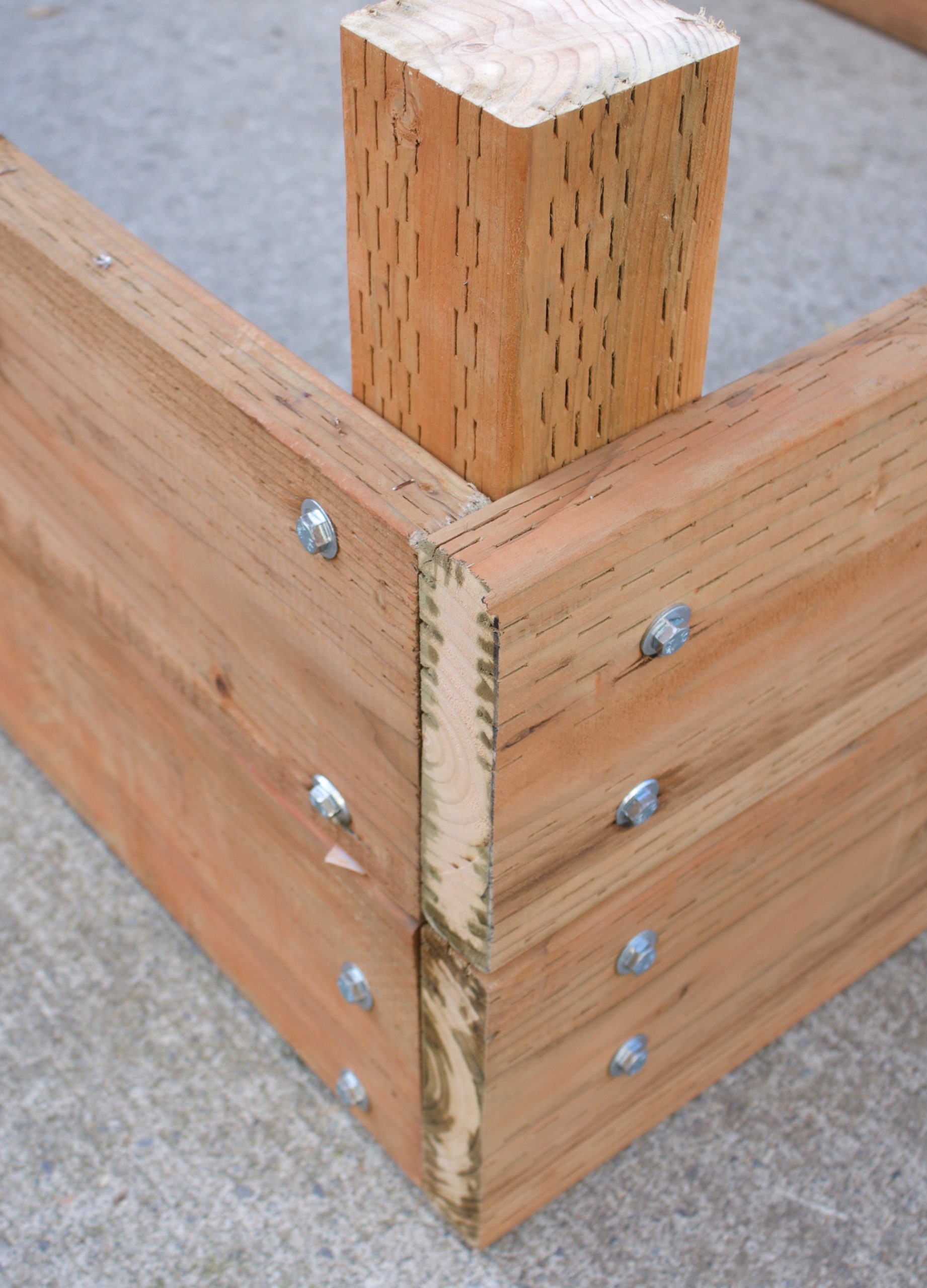 lag bolts in the corner of the bed. 