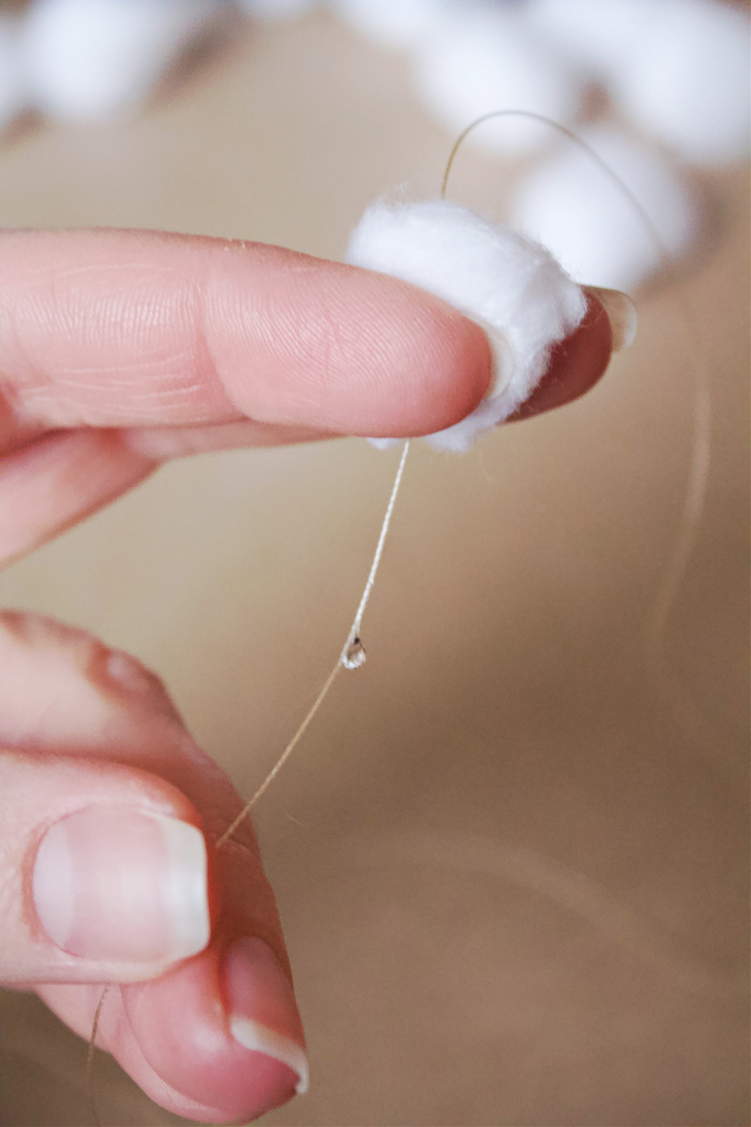 This snow garland cost $1.99 to DIY, and it turned our basement into a winter wonderland. All you need is some string, cotton balls and glue.
