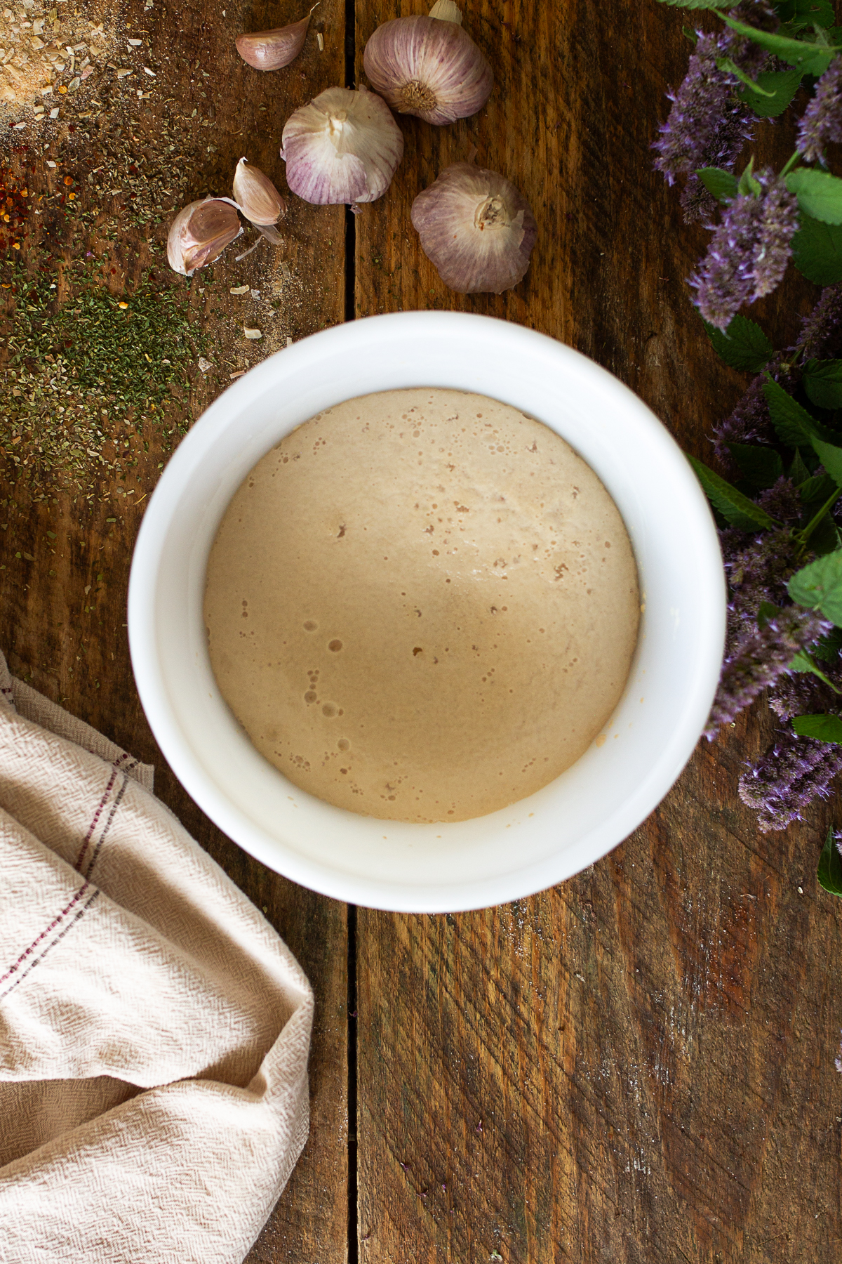 Blooming yeast in white bowl.