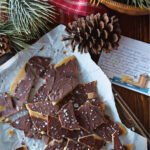 toffee in parchment paper on the counter.