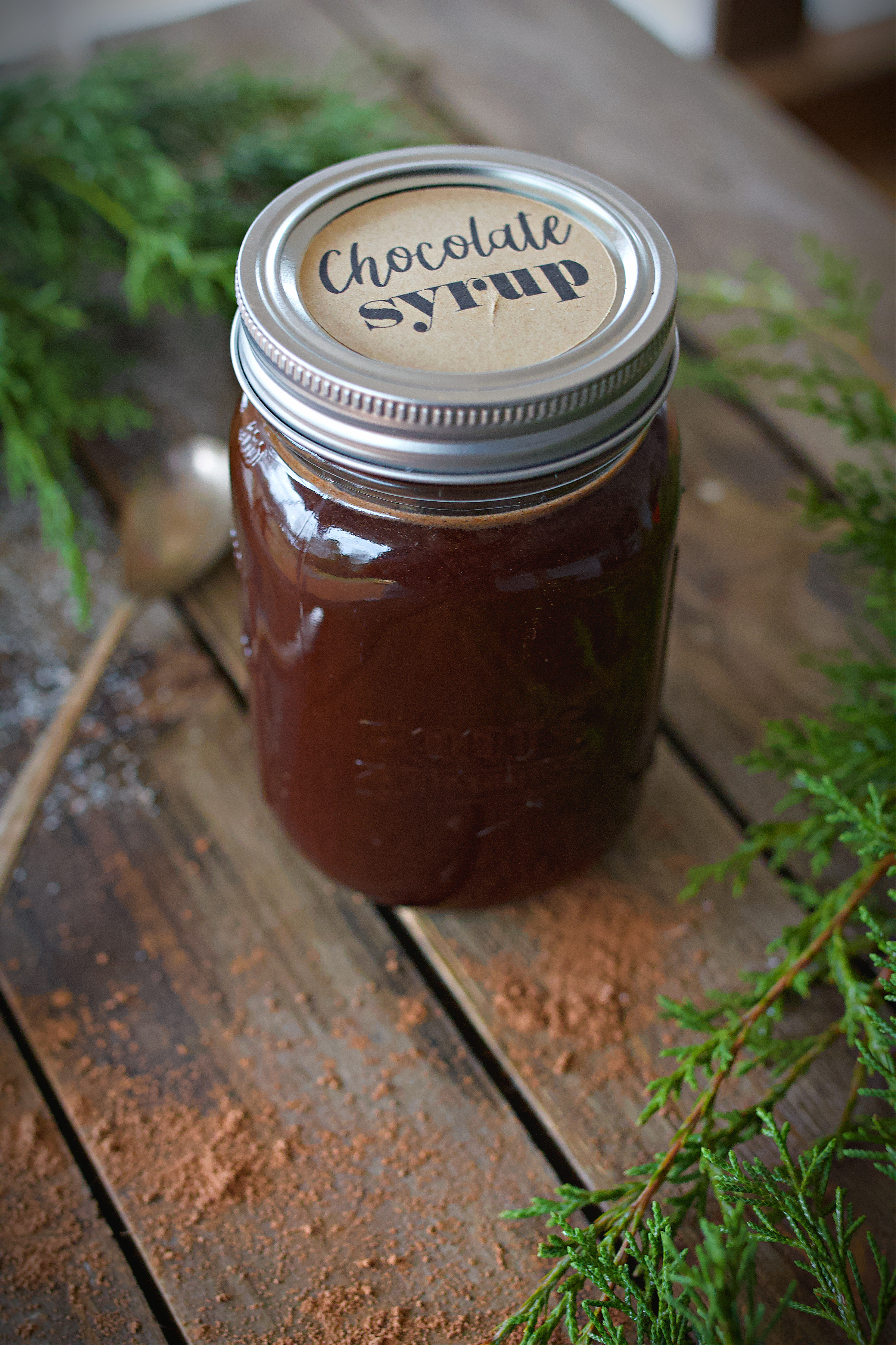 Full pint of chocolate syrup on the counter.