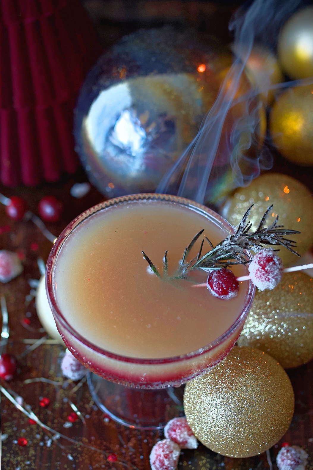Cranberry orange spritzer on festive decorated table ready to serve. 