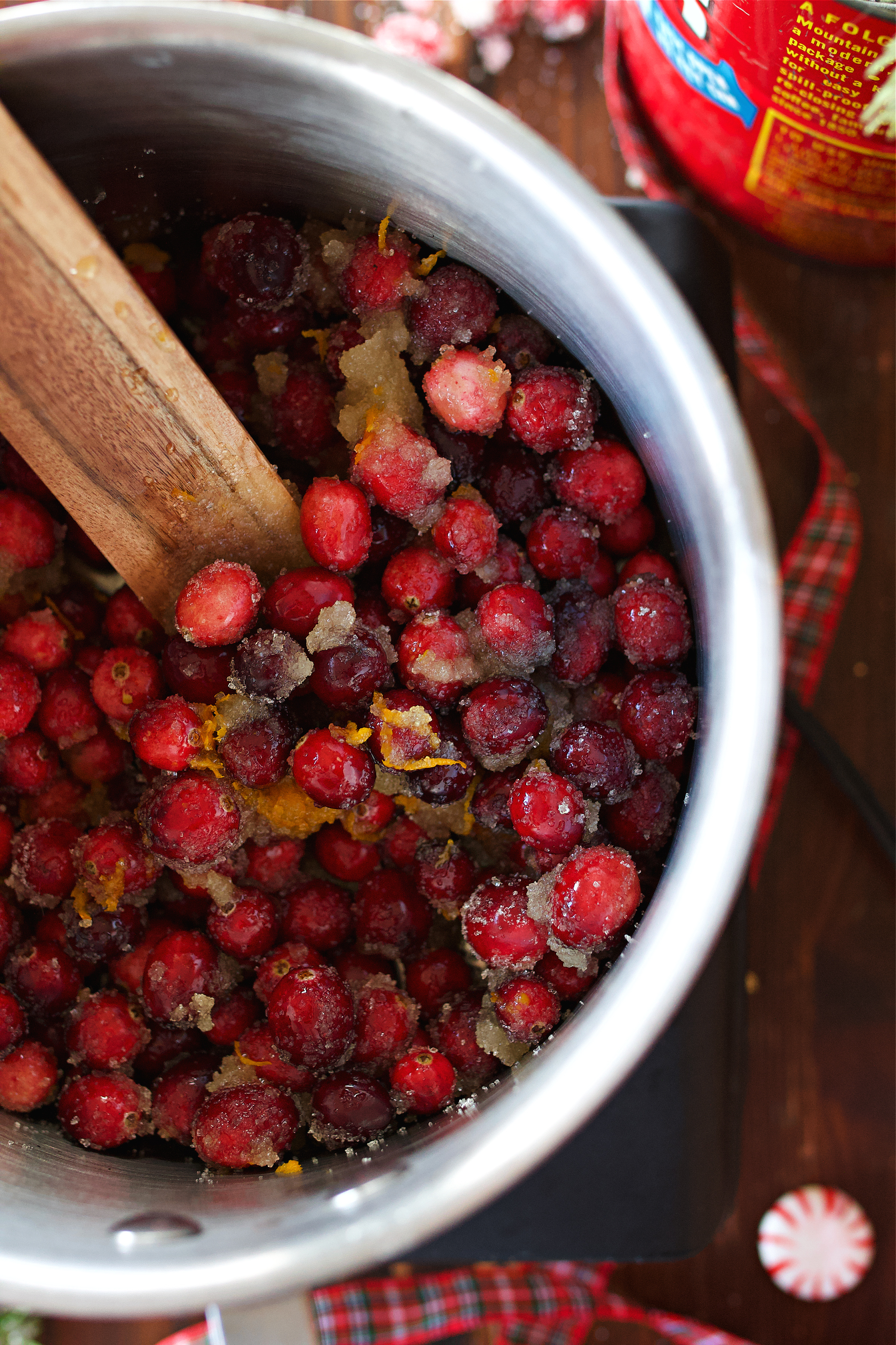 cranberries in saucepan with other ingredients being cooked down.