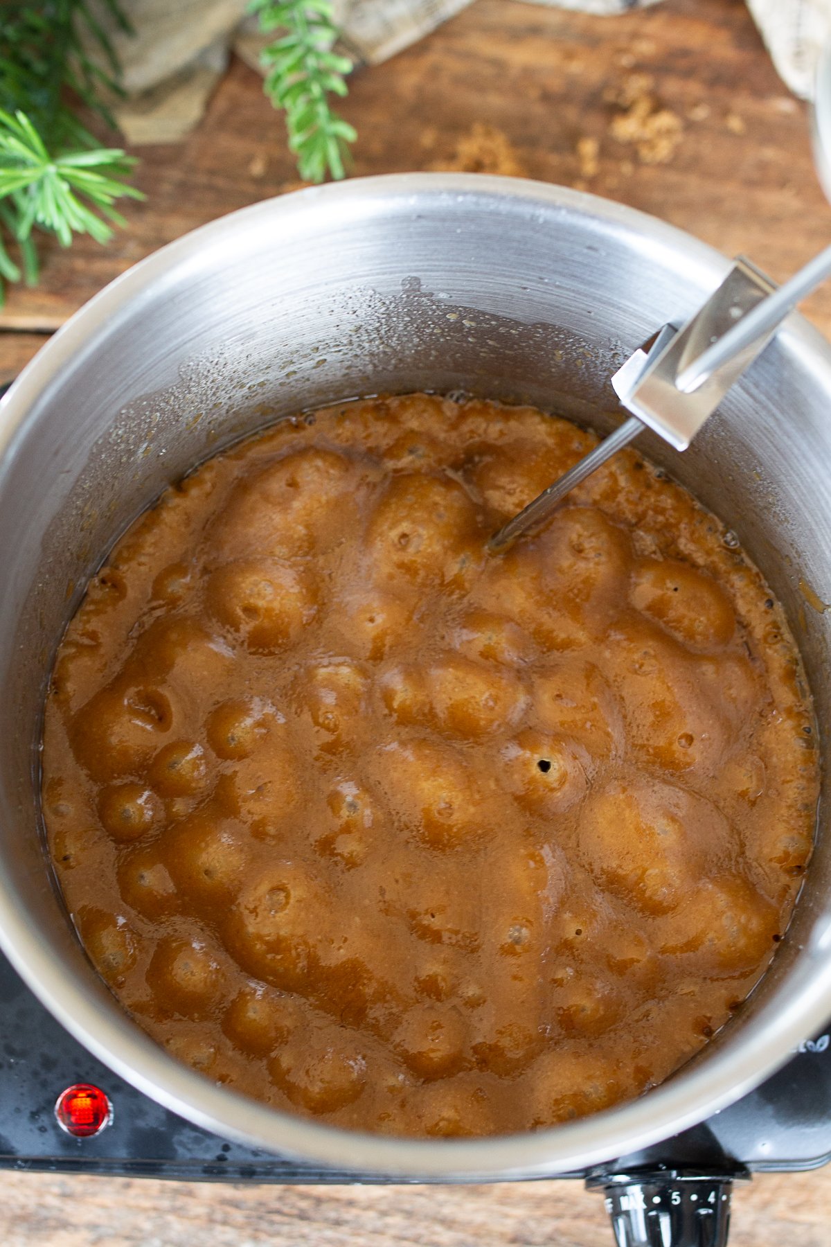 Toffee at temp in a saucepan ready to pour onto baking dish.