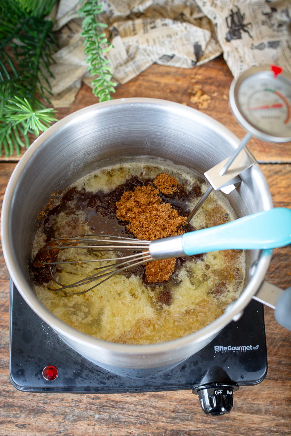 Adding brown sugar to melted butter in saucepan.