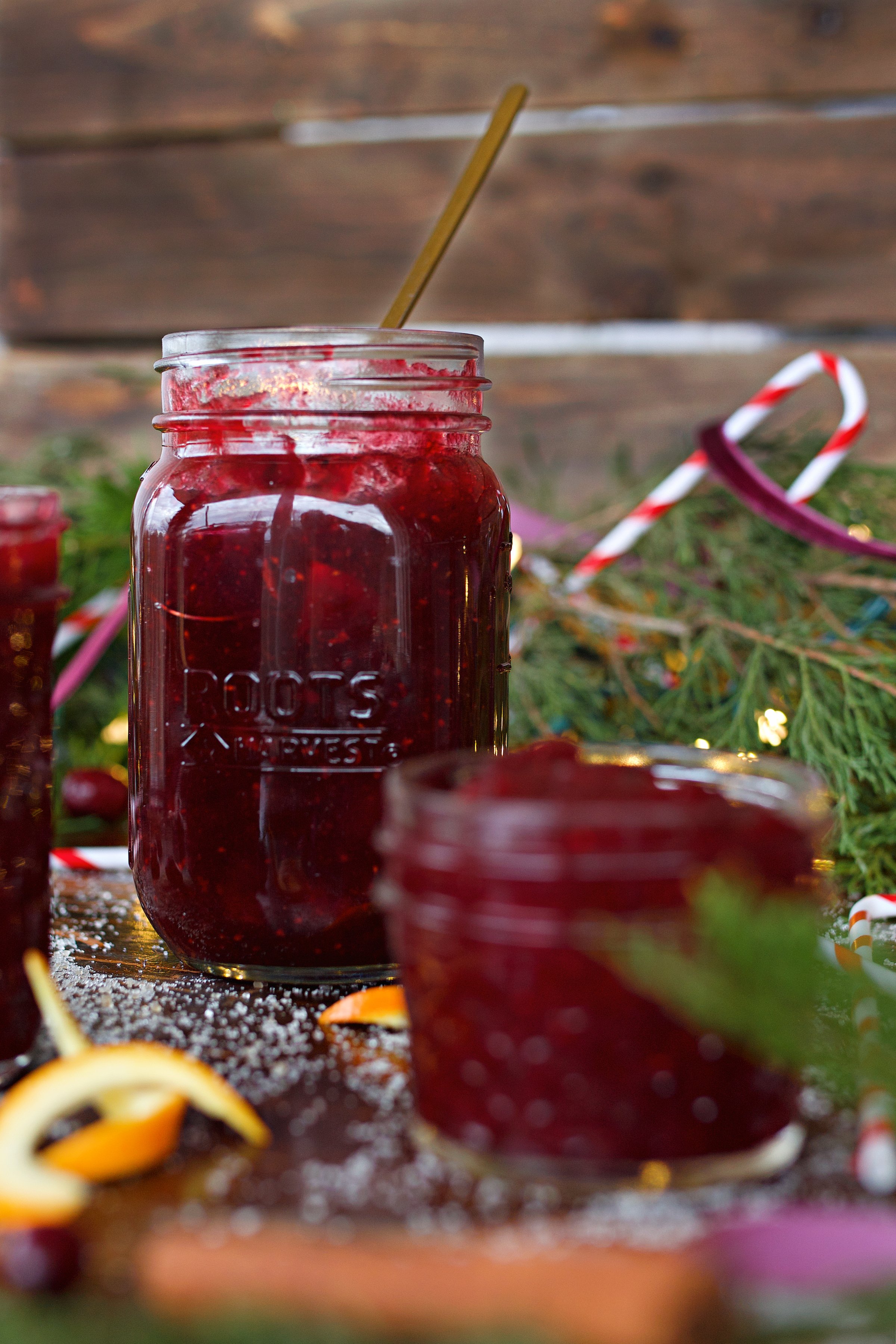 Open jars of spiced cranberry jam on counter