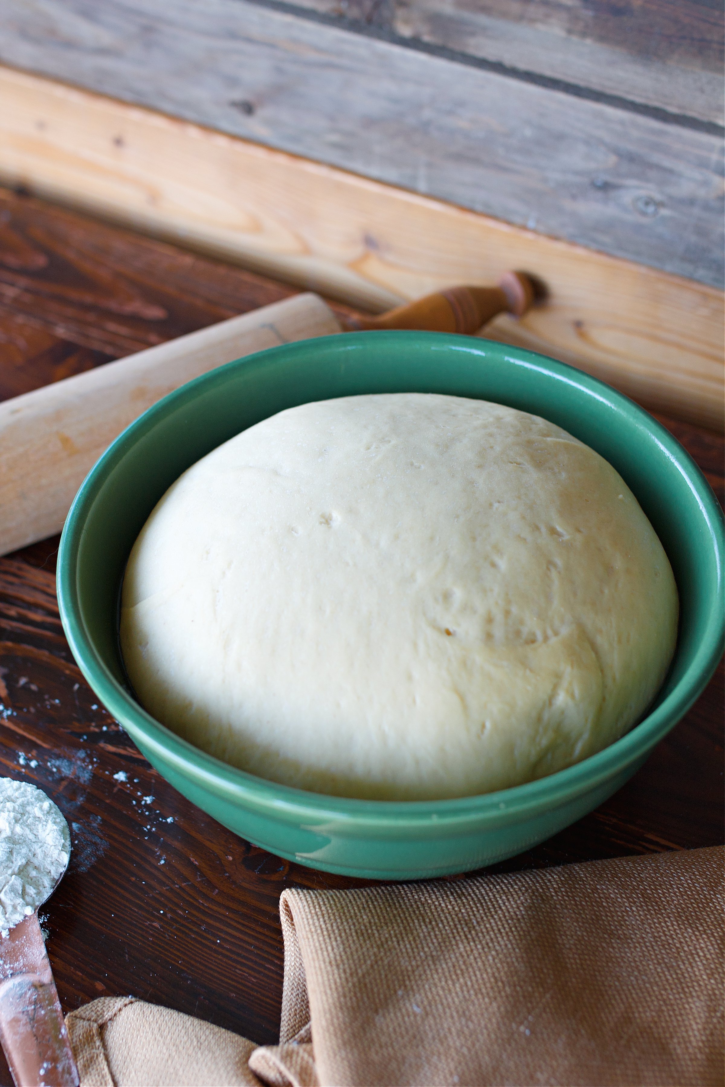 Dough in ceramic bowl having been rising for an hour and ready for the next step.