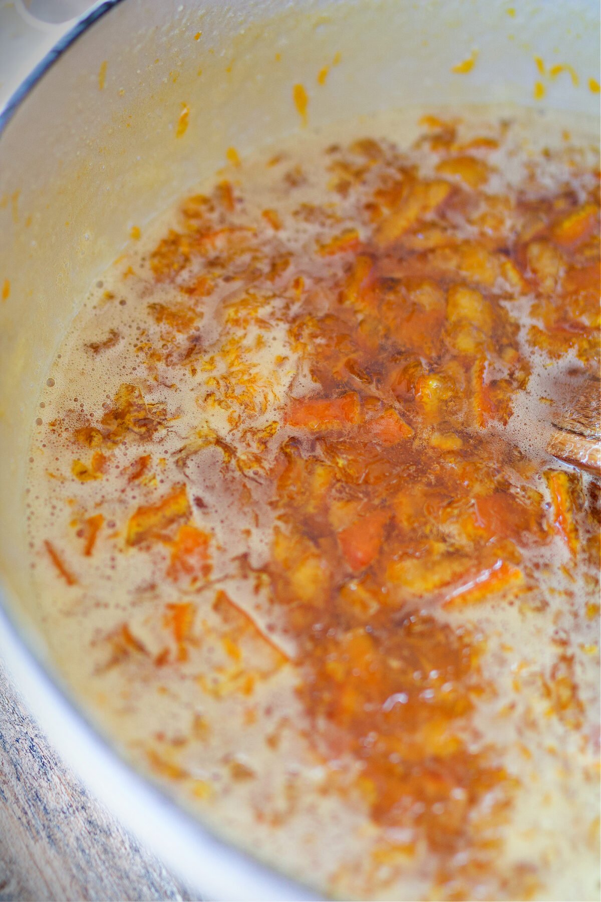 Marmalade simmering in stockpot.