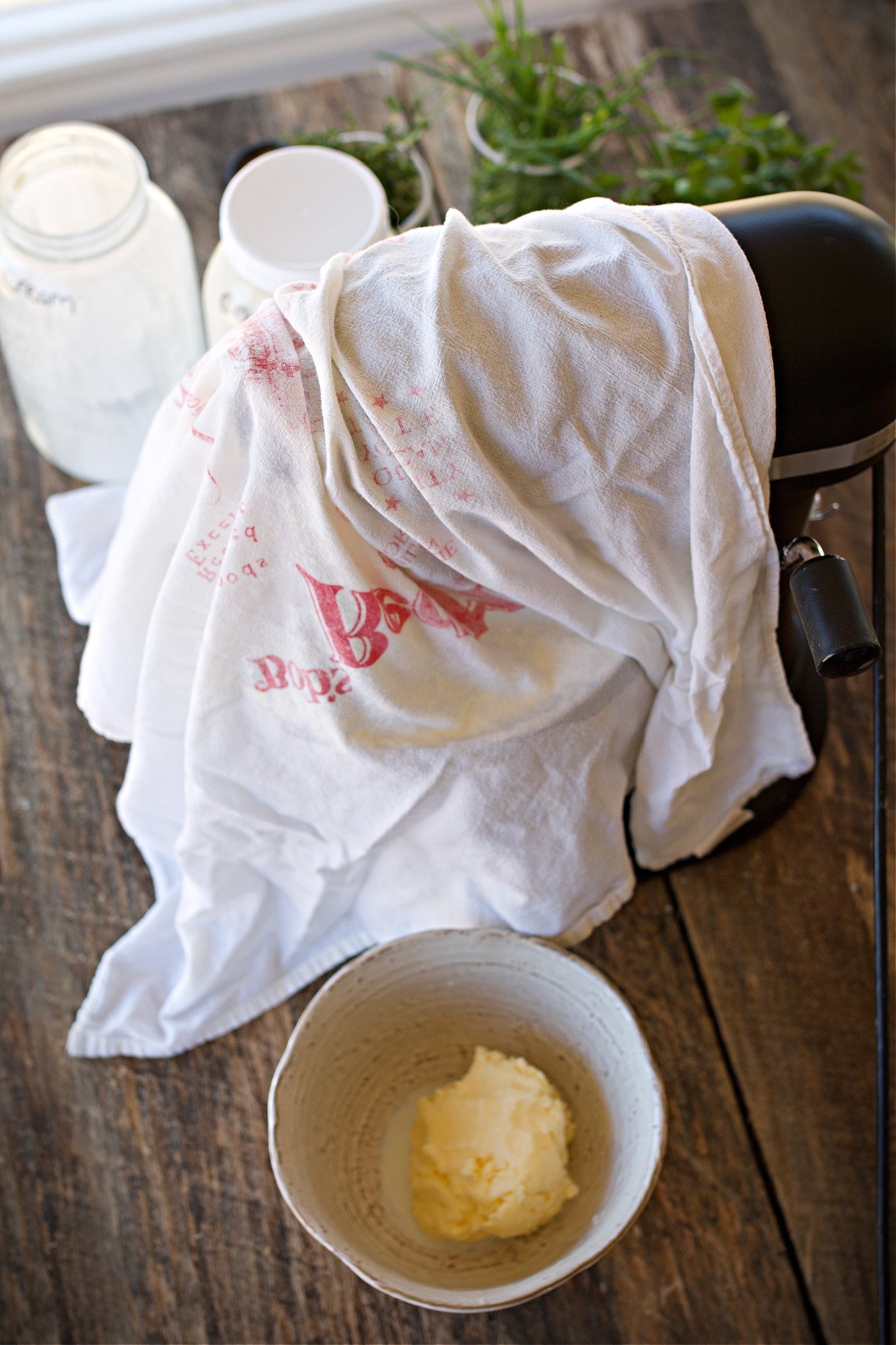 butter being made in a kitchen aid and butter that was just finished in bowl. 
