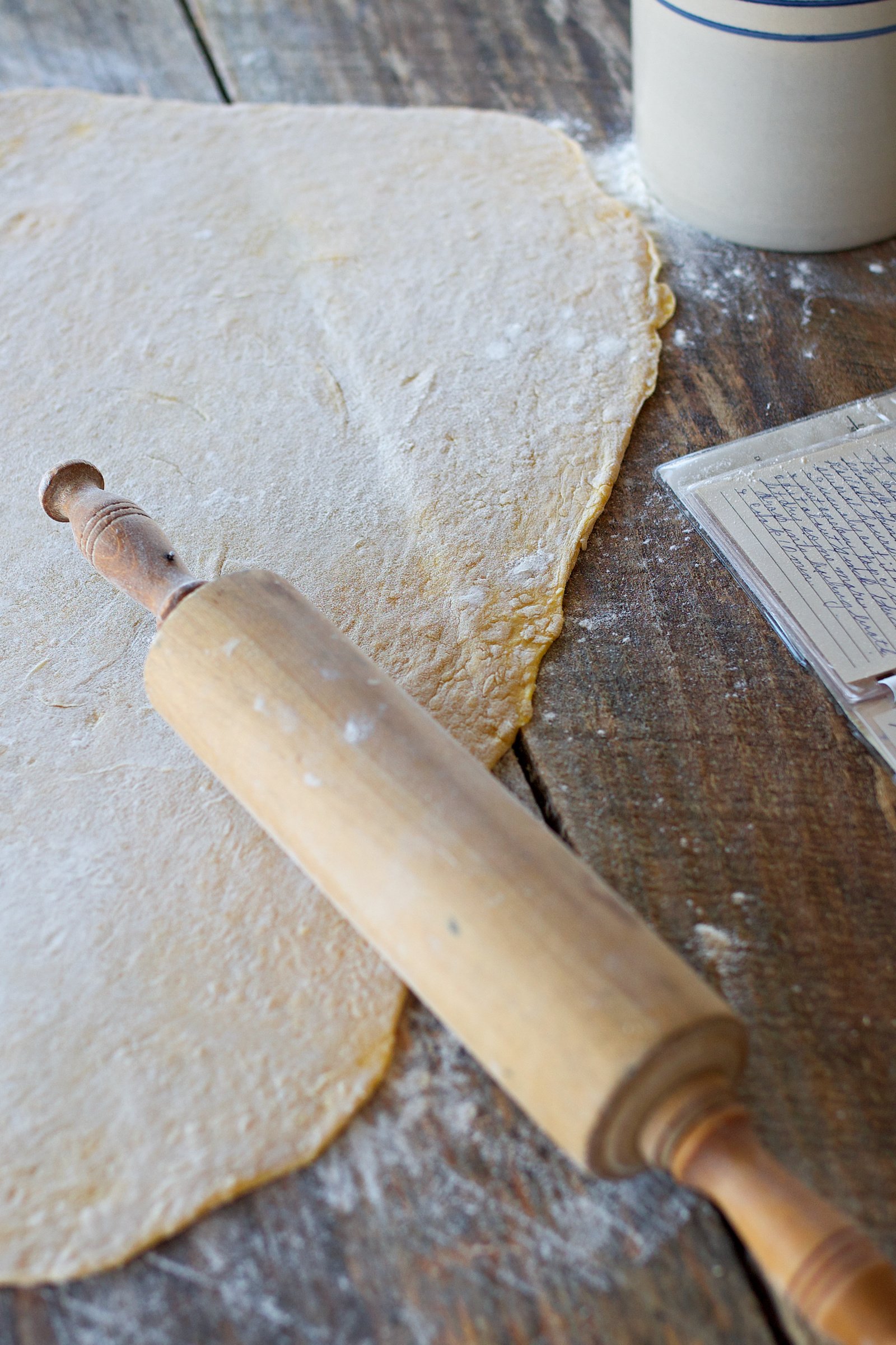 Dough rolled flat on counter.