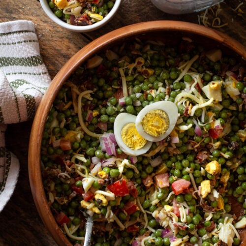 Pea salad in a wooden bowl.