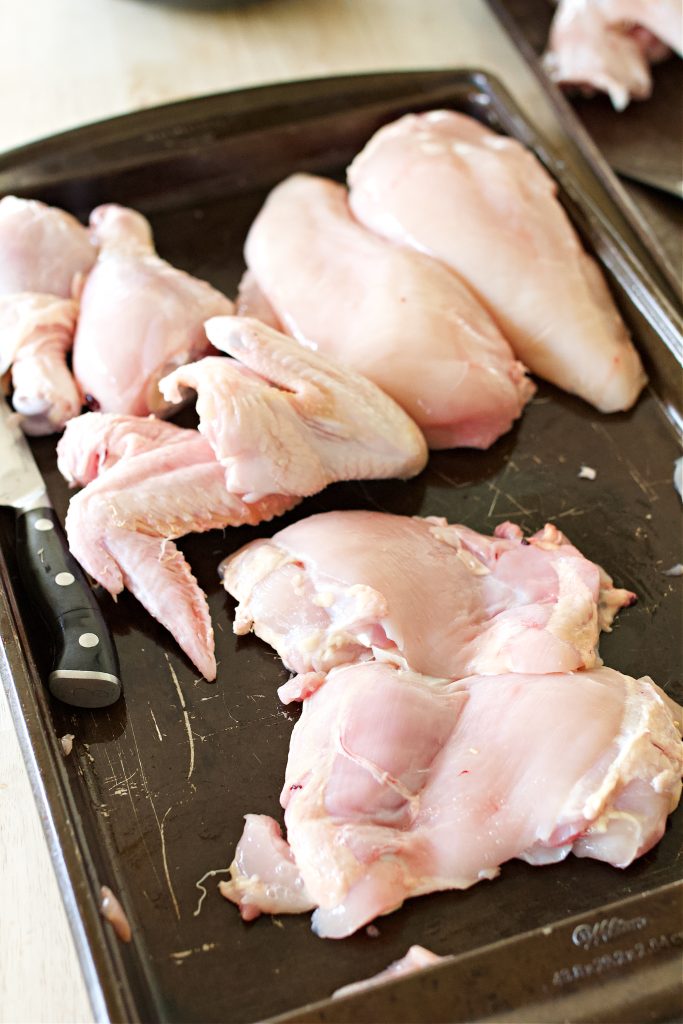 pieced out whole chicken that has been cut into sections.