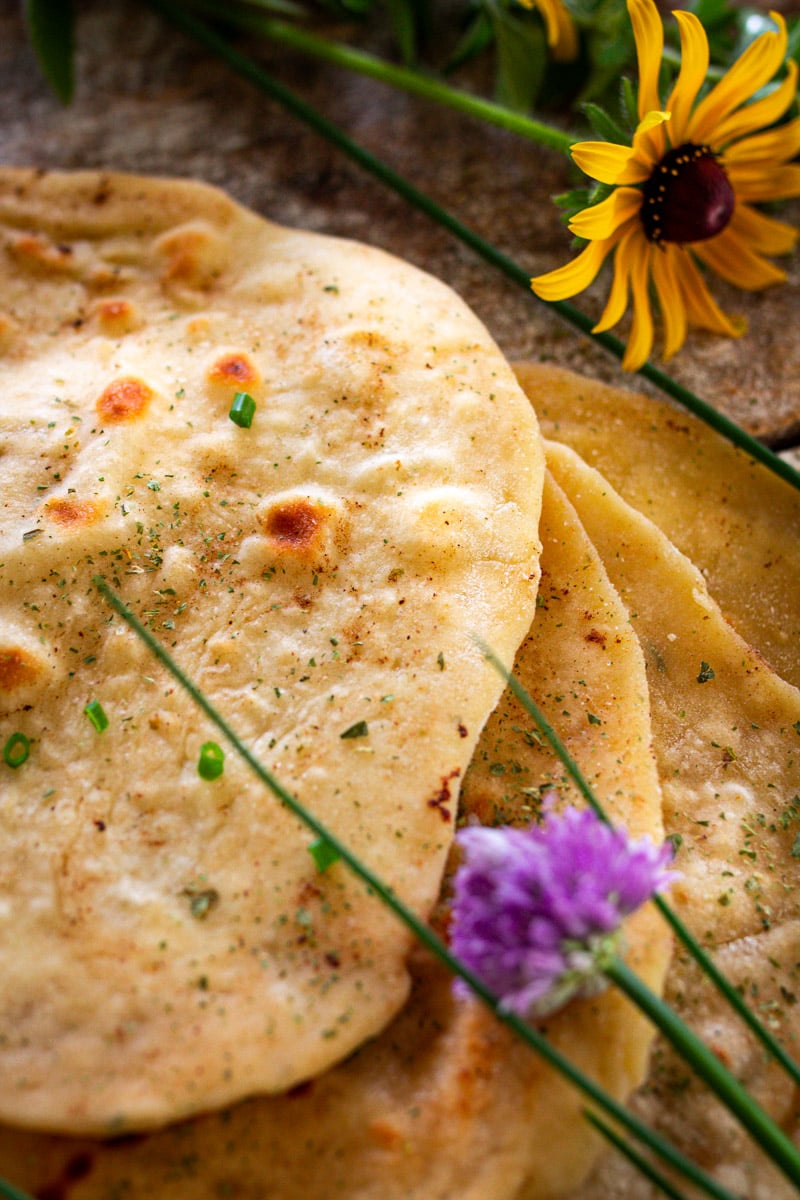 Flatbreads on counter cooked and ready to serve. 