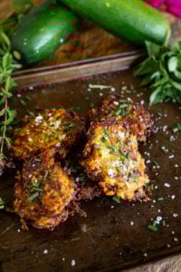 Zucchini fritters on pan fried and ready to eat.