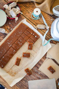 Caramels being cut into bite size pieces.