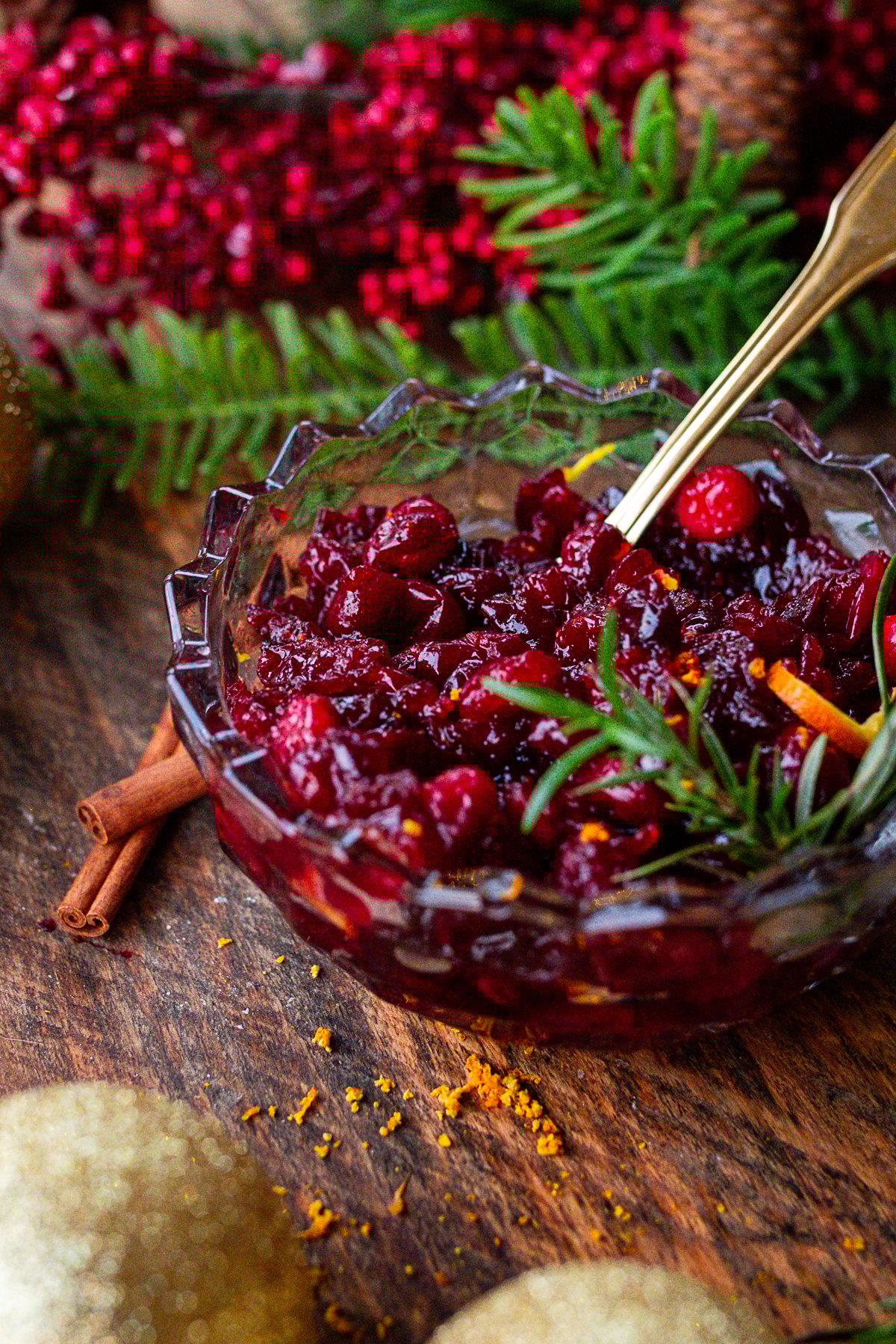 cranberry sauce being served on rustic wooden table.