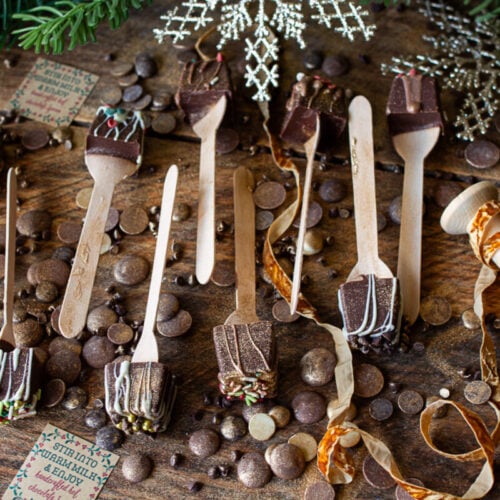 Nine hot cocoa spoons on counter ready to be wrapped and gifted.