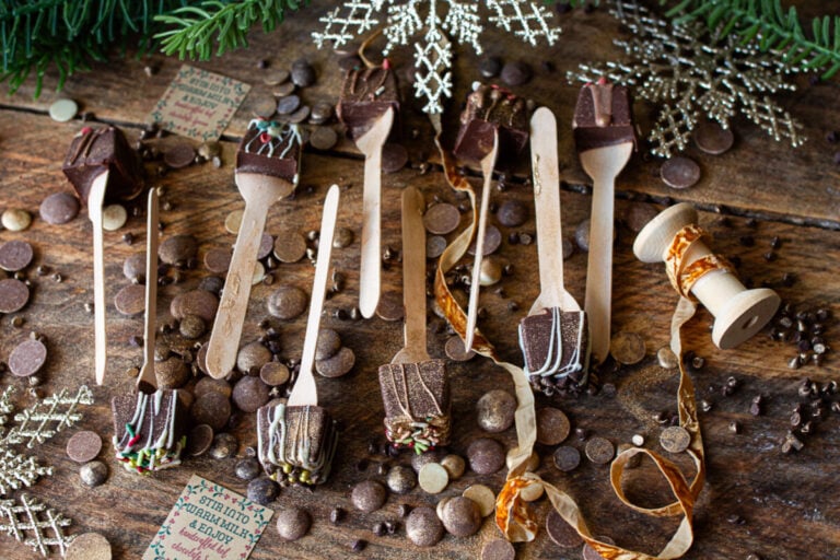 Nine hot cocoa spoons on counter ready to be wrapped and gifted.