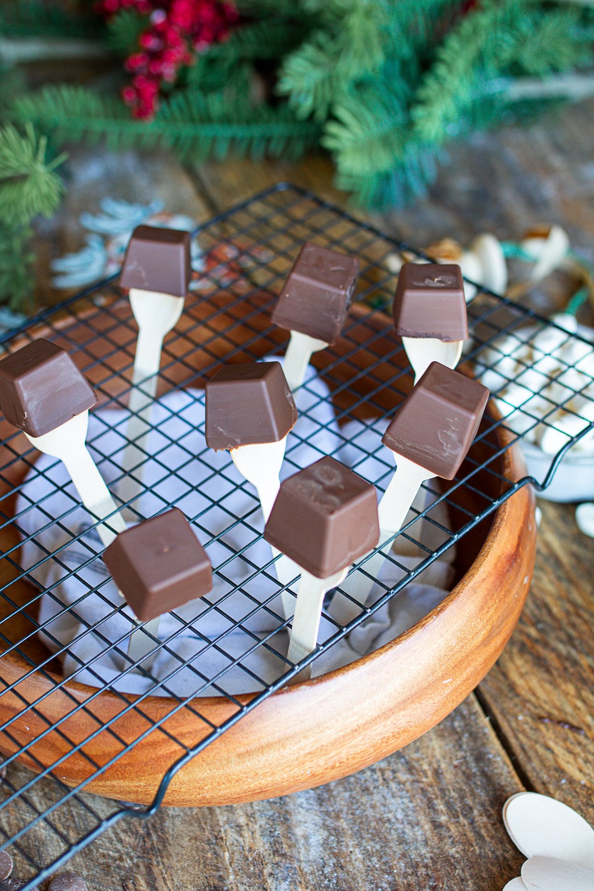 Chocolate spoons standing on end waiting to be decorated.