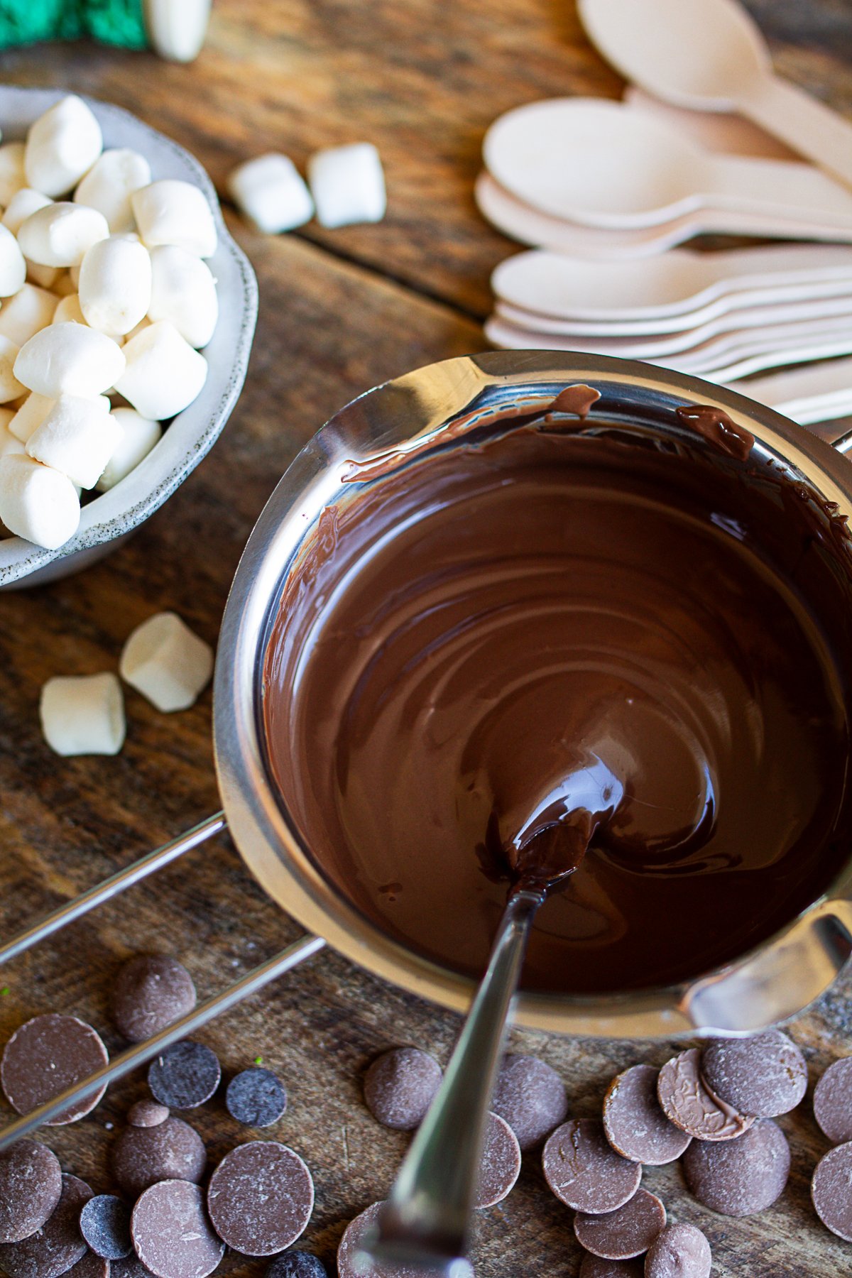 chocolate melted in top of a double boiler stainless steel bowl.