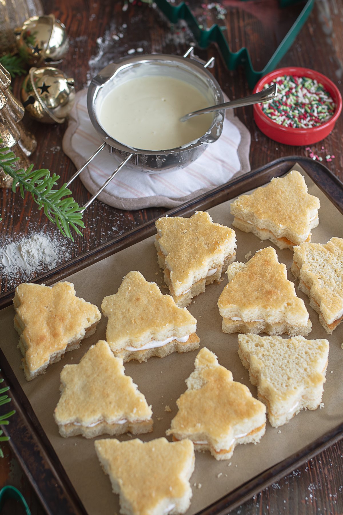 filled Christmas tree cakes ready to be dipped in chocolate coating.