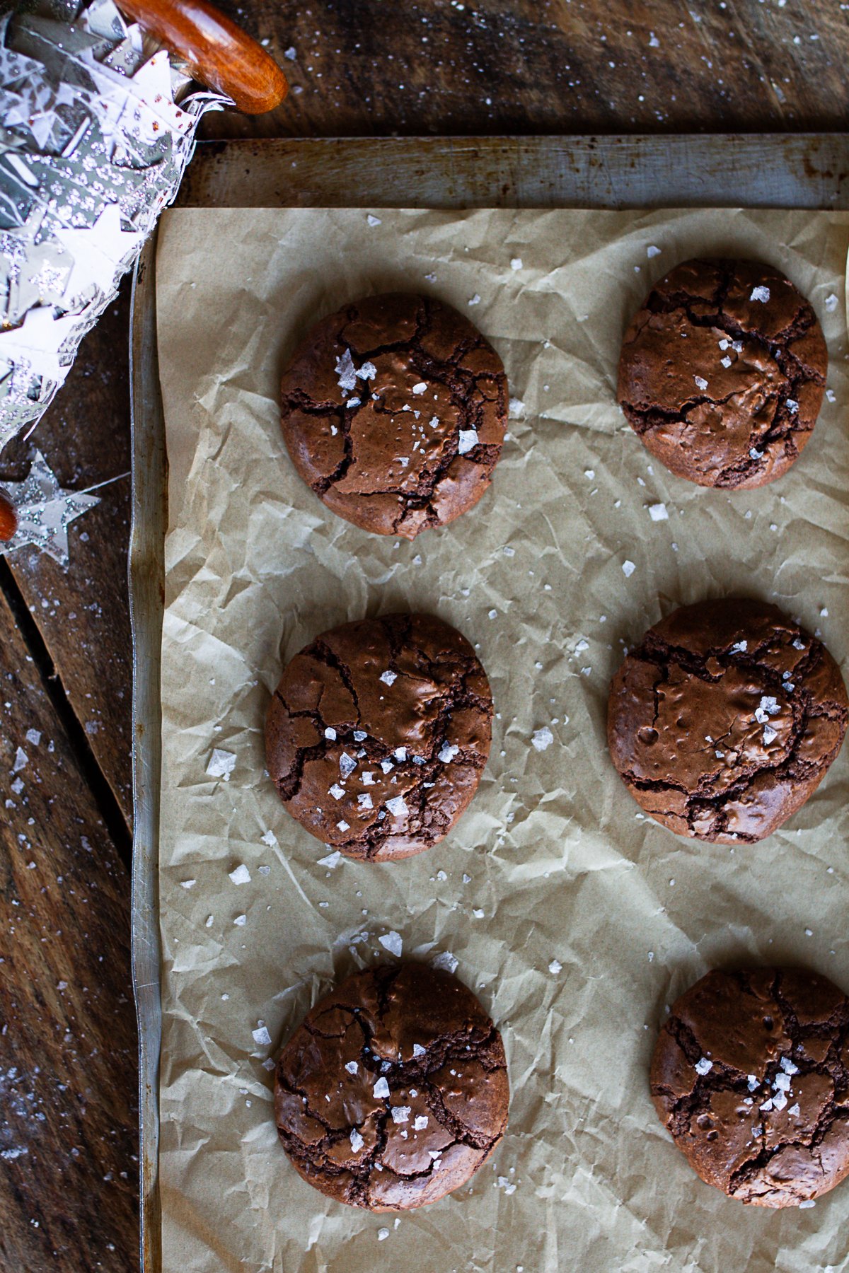 Cookies just baked on counter sprinkled with flake salt. 