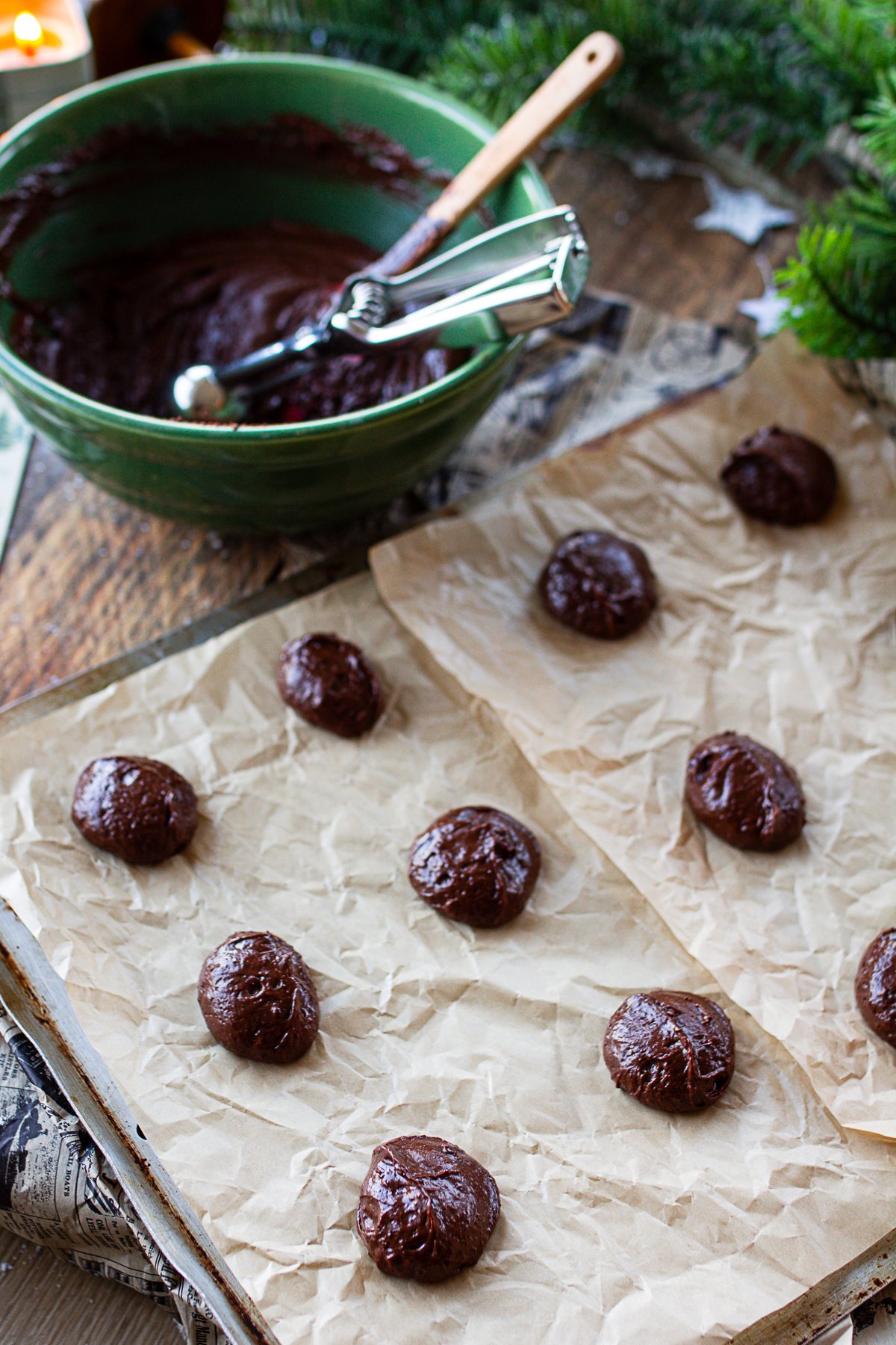 Spooning out cookie dough onto baking sheet. 