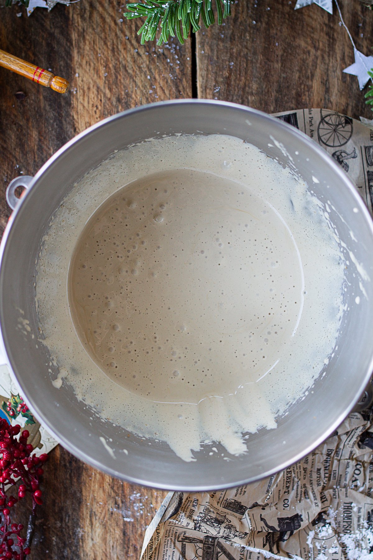 Whipped eggs and sugars in mixing bowl.