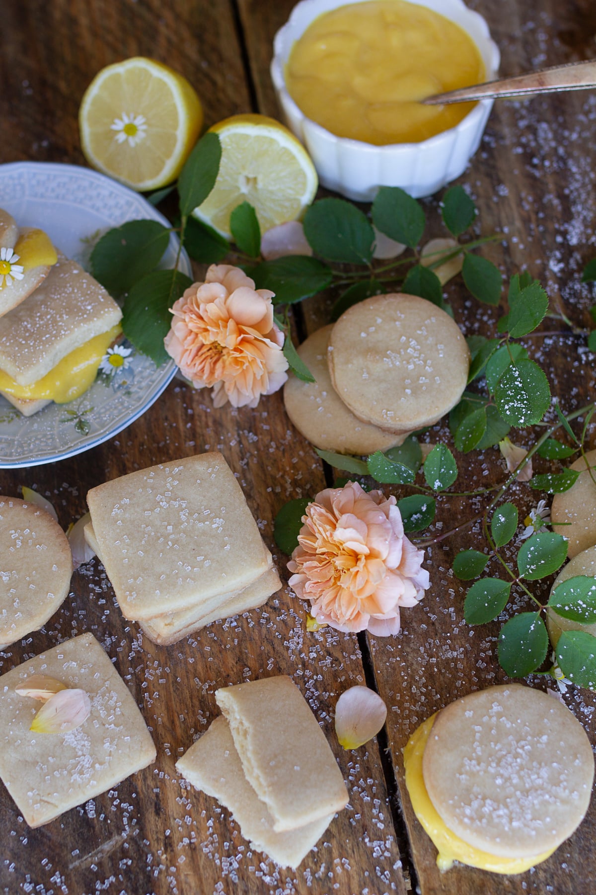 Close-up of homemade shortbread cookies showing the soft buttery crumb texture on a wooden surface.
