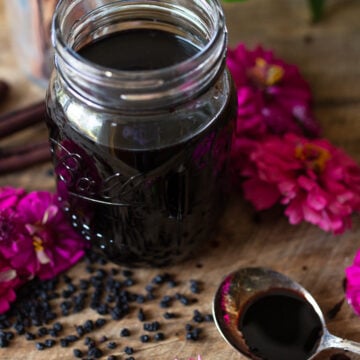 Mason jar filled with homemade elderberry syrup made from dried elderberries