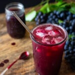 Cold Concord grape juice made from homemade grape juice concentrate served over ice