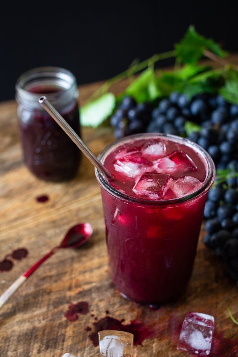 Cold Concord grape juice made from homemade grape juice concentrate served over ice